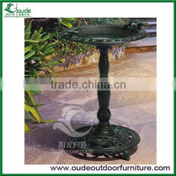 garden fountain with bird drinking water