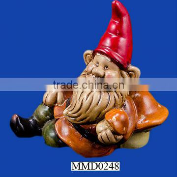 Fancy reclining garden gnome pottery statue