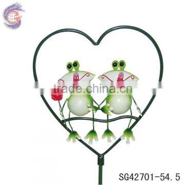 handmade heart shaped metal frog in garden decoration