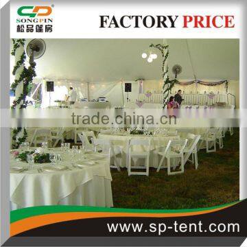 Corporate event Solid white 40'x40' pole tent set with tables and chairs and dance floor