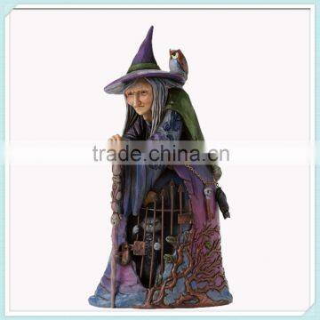 Halloween Wiccan witch with cat behind gate