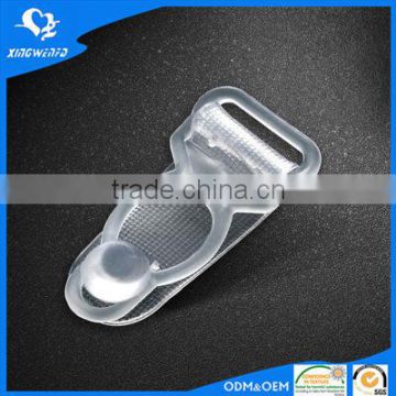 Transparent plastic suspender clip in womens garment accessory