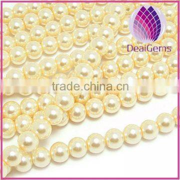 Bead glass pearl light yellow 12mm round.