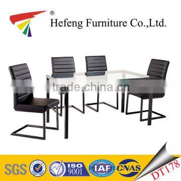 strong tube legs factory price clear tempered glass dining table with leather chair