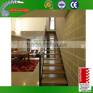 Modern straight wooden staircase with glass railing