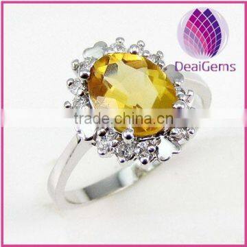 Ring sterling silver and citrine 7x9mm faceted oval with twelve-rhinestone