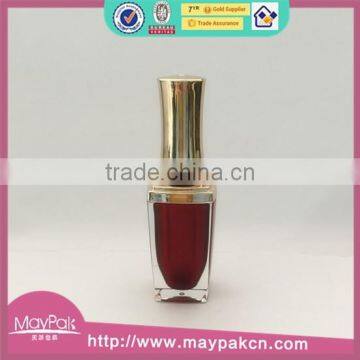 Red painted nail polish bottle with UV cap and shoulders