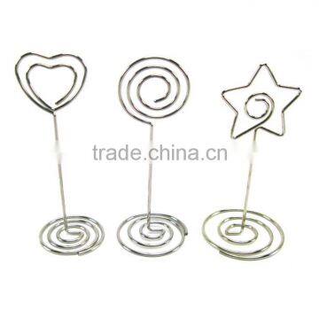 heart shaped wire holder memo clips with spiral wire base for party favors at a wedding reception