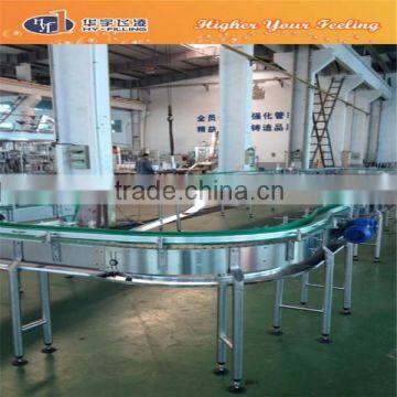 Filled bottle output conveyor