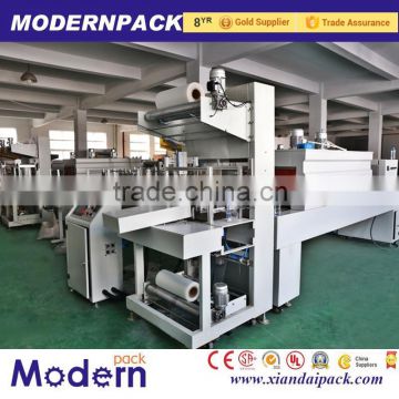 Automatic wrapping and heat shrinking machine