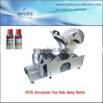 manual roud bottle self adhesive labeling machine