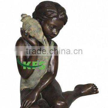 Bronze indian girl with shell sculpture