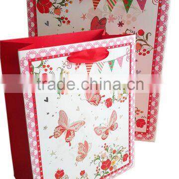 butterfly print 210gsm ivory paper bag with satin ribbon