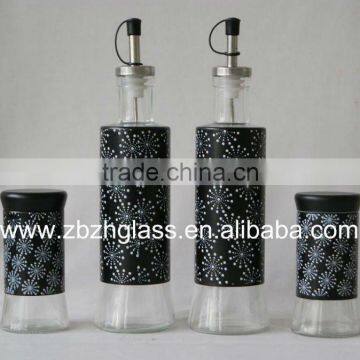 Black metal covering glass oil and vinegar bottle set