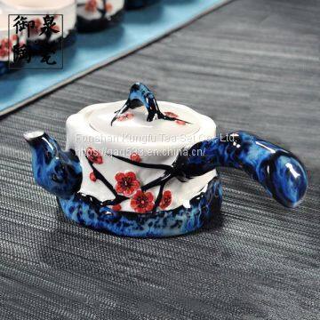 The hand-painted office tea set in the pottery kiln