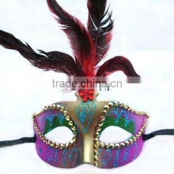 feather and party mask