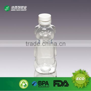 Wholesale promotional plastic bottle for hoeny storage honey jars cheap clear plastic jars