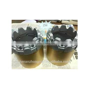 Stepped bottom spray impregnated diamond core bit