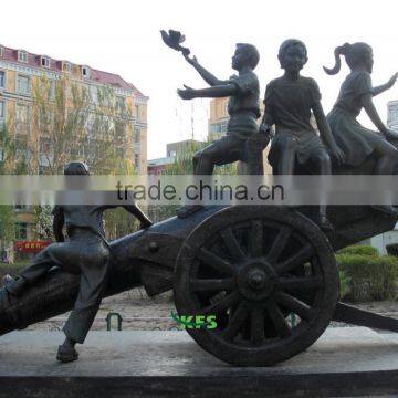 Bronze children playing in cannon statue