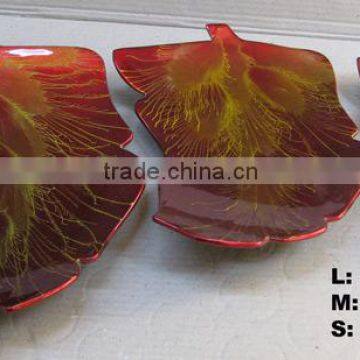 Set of three lacquered leaf shape plates