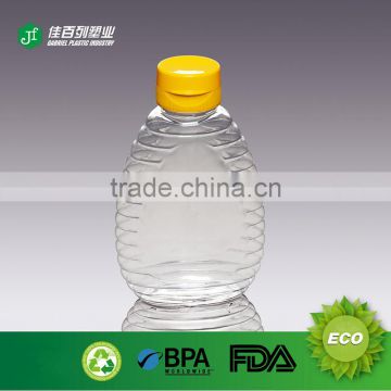 Popular PET clear 250g plastic honey bottle with silicone valve cap