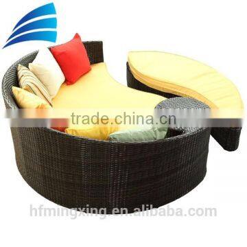 Outdoor wicker patio sofa set with yellow cushions