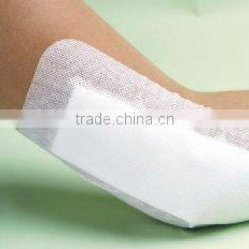 Non-woven absorbent adhesive dressing