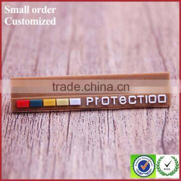 Wholesale private brown silicone rubber label for t-shirt handbags