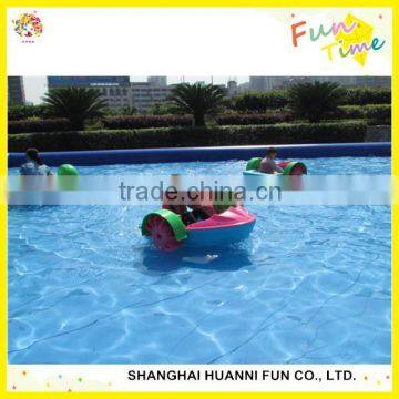 Amusement park kids use swimming pool paddle boat,hand paddle boat