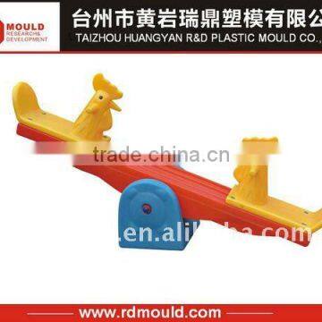 plastic baby ' s see-saw mould