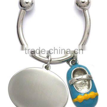 Baby shoe Horse Shoes keyring, attached with logo tag