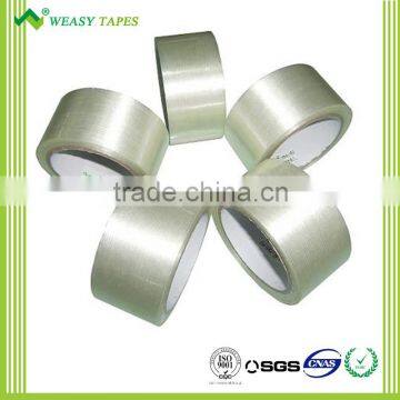 High strength filament reinforced strapping tape