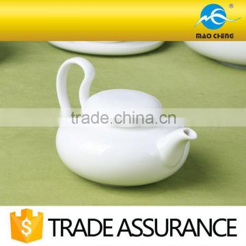 white ceramic soy sauce and vinegar pot