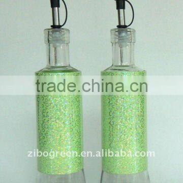 round glass oil bottle with metal casing (TW675T22)