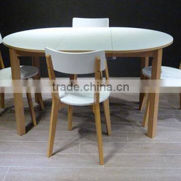 white wood round extendable dining table