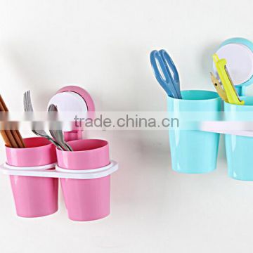 Adhesive toothbrush holder with suckers and two cups