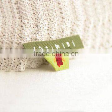 Delicate handmade woven label