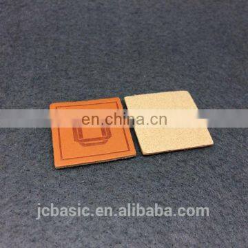 Cheap pu leather label custom jean labels