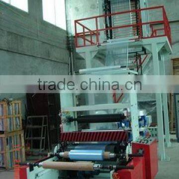 Film blowing machine with automatic winder