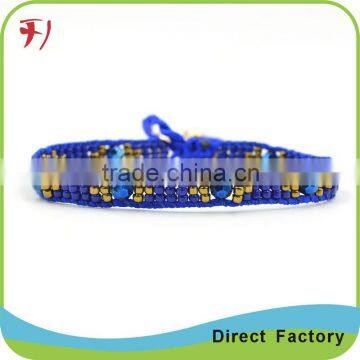 Imitation jewellery yellow tassels bracelet with charms wholesale