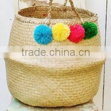 Best selling gold seagrass belly basket with pompoms