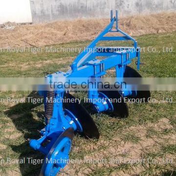 disc plough mounted onto diesel power driven tractors