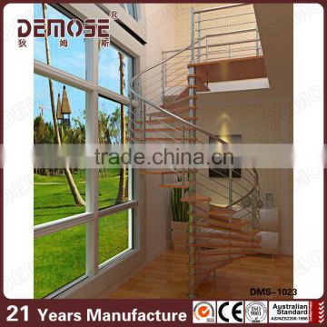 spiral wood staircase and stainless steel railings