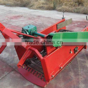 agricultural farming Potato Harvester in field and soil