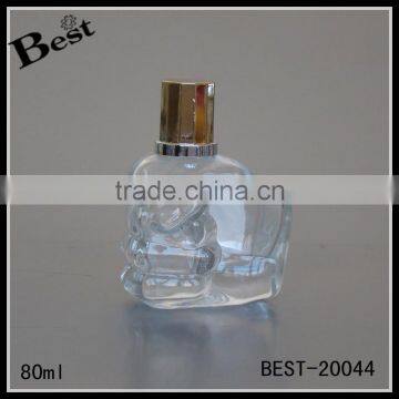 80ml cosmetic perfume clear unique glass bottle hand shaped bottle glass with gold metal pump sprayer china supplier manufacture