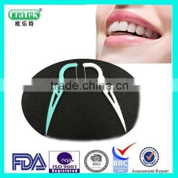 plastic dental flosser with mint flavor OraTek