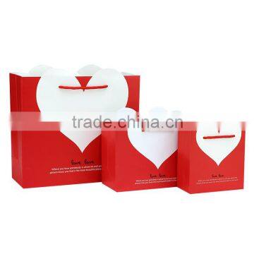 Hand gift paper bag /made with glossy lamination 210gsm ivory paper bag