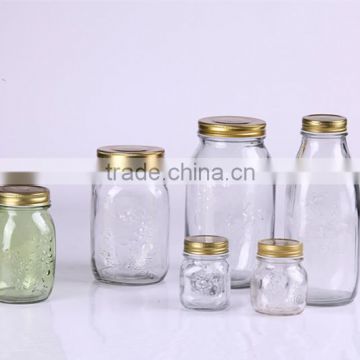 transparent embossed glass jam jar with tin cover