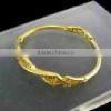 A gold round shape bracelet