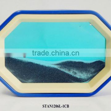 Octagonal colourful sand art in motion,blue frame